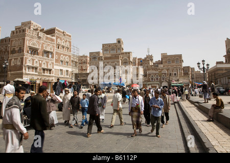 Souk, buildings made of brick clay, marketeers, square in front of the Bab El Yemen, Sana, UNESCO World Heritage Site, Yemen Stock Photo