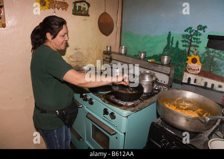 Chef cooking in the kitchen of a small restaurant, Sierra Nevada, Andes, Venezuela, South America Stock Photo