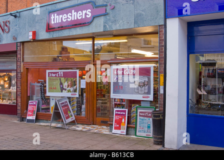 Threshers off license selling cheap alcohol with offers advertised on boards outside shop store in Woodbridge,Suffolk,Uk Stock Photo