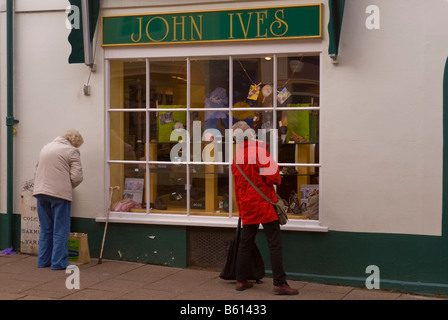 John Ives shop store in Woodbridge,Suffolk,Uk selling shoes and footwear with people window shopping Stock Photo