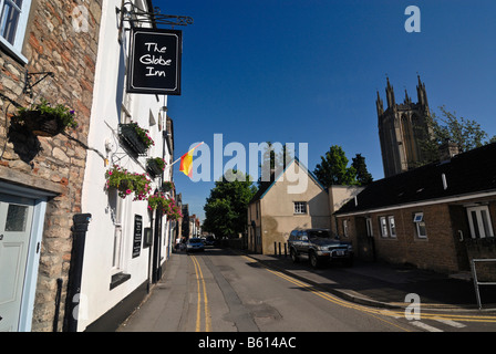 Street in the town of Wells with a sign for The Globe Inn pub, Somerset, England, Great Britain, Europe Stock Photo