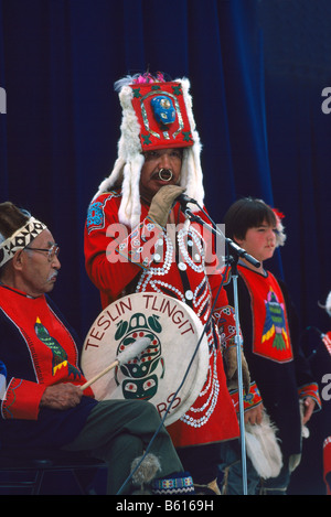 Native American Tlingit Indian Family celebrating at a Pow Wow in Traditional Ceremonial Regalia Dress Stock Photo