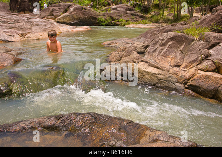 CAYO DISTRICT, BELIZE - Boy swims in Rio On pools in the Mountain Pine Ridge Forest Reserve. MR