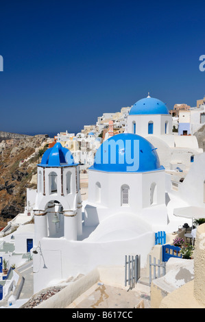 Blue and white domed church and bell tower, Oia, Ia, Santorini, Cyclades, Greece, Europe Stock Photo