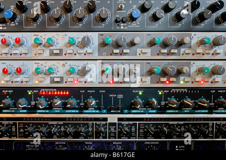 Different buttons and controllers on a mixer and amplifier in a sound studio Stock Photo