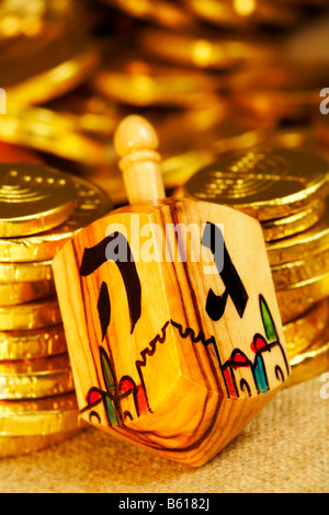 Jewish  Olive Wood Dreidel Dreydles with Hanukkah Chanukah chocolate gold coins gelt Stock Photo