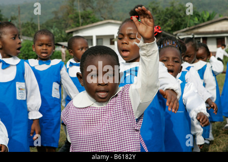 Pre-school children wearing uniforms during morning exercise, Buea, Cameroon, Africa Stock Photo