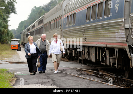 Amtrak railroad passengers alight from train DeLand Train Station Florida America USA Stock Photo
