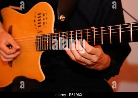 Man playing an electric guitar Stock Photo