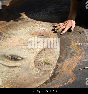 An artist draws Botticelli's 'Birth of Venus' on the streets of Florence on a sunny summer's day, Italy Stock Photo