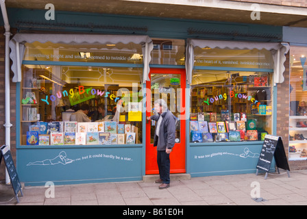 Man exiting the Young Browsers book shop store in Woodbridge,Suffolk,Uk Stock Photo