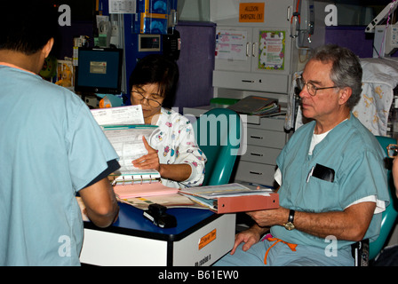 Medical team at Texas Childrens Hospital in consultation meeting in ward before going on their rounds Stock Photo