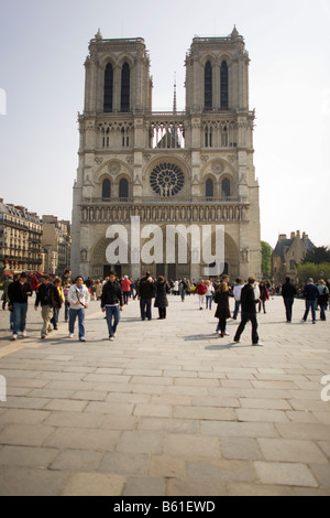 Visitors gather outside the West Front of Paris’ Cathedral of Notre-Dame Stock Photo