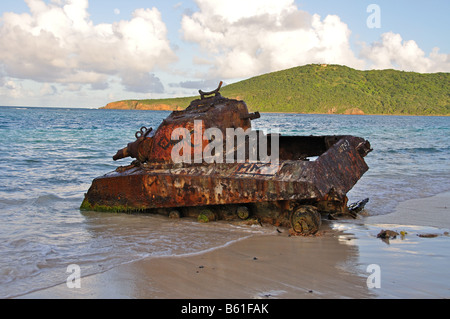 an old rusted out tank sits on flamenco beach on isla culebra puerto rico Stock Photo