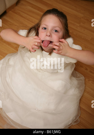 5 year old girl having a temper tantrum and poking out her tongue Stock Photo