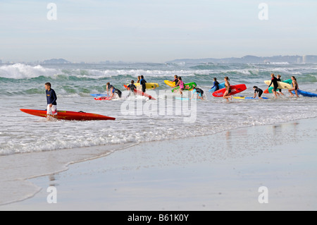 Young surfers on the beach of Surfers Paradise, Queensland, Gold Coast, Australia Stock Photo