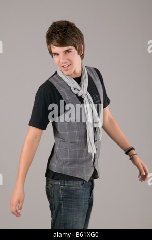 Young man turning smiling towards the camera Stock Photo