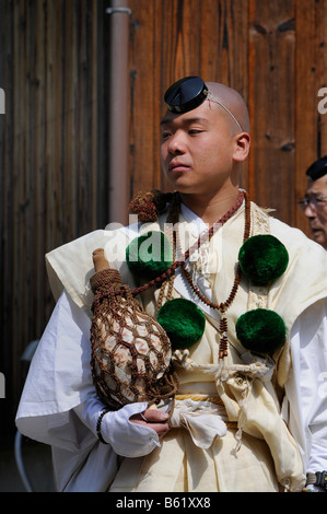 Yamabushi conch shell blower wearing traditional headdress and clothing, Shogoin Temple near Kyoto, Japan, Asia Stock Photo