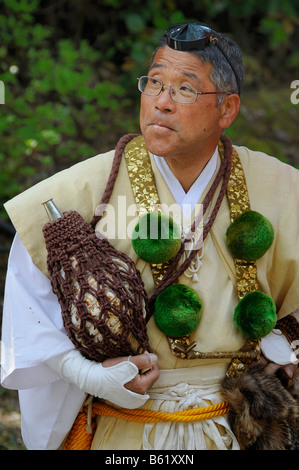 Yamabushi conch shell blower wearing traditional headdress and clothing, Shogoin Temple near Kyoto, Japan, Asia Stock Photo