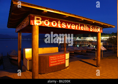 Night-time illuminated boat hire in Prien, Lake Chiemsee, Chiemgau, Upper Bavaria, Germany, Europe Stock Photo