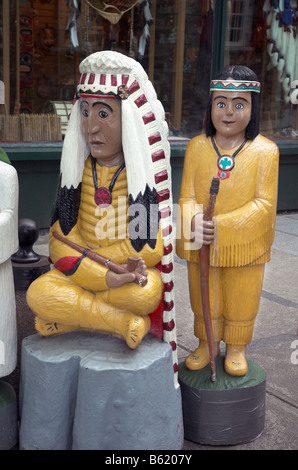 A wooden carving of a native american woman and child Stock Photo