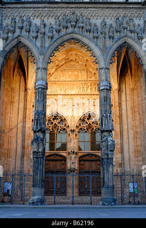 Illuminated main door of Ulm Minster, Ulm, Baden-Wuerttemberg, Germany, Europe Stock Photo