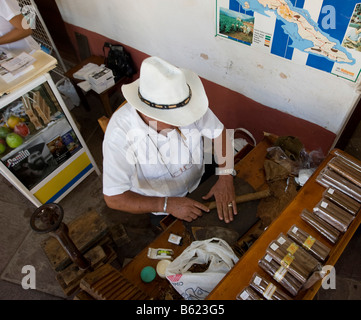 Cuban making a cigar from tobacco, Trinidad, Sancti Spíritus province, Cuba, Latin America, America