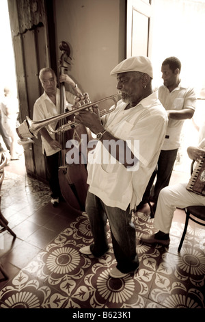 Cuban jazz musicians playing in a restaurant, Plaza Mayor, Trinidad, Sancti-Spíritus province, Cuba, Latin America Stock Photo