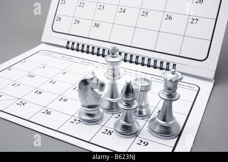 Chess Pieces on Calendar Stock Photo