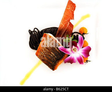 Sea bass with sepia noodles, food, haute cuisine Stock Photo