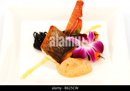 Sea bass with sepia noodles, food, haute cuisine Stock Photo