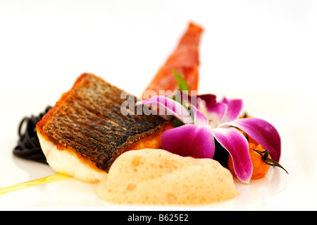 Sea bass with sepia noodles, food, haute cuisine Stock Photo