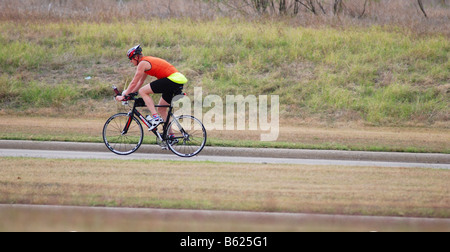 Long distance bicyclist riding a bicycle Stock Photo