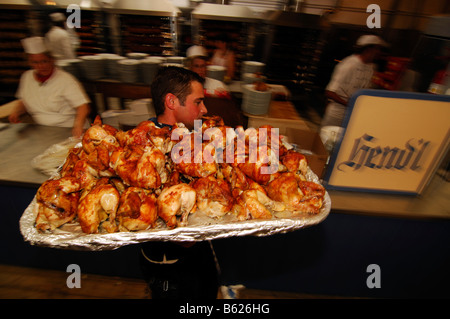 Waiter with roast chicken, Wies'n, October fest, Munich, Bavaria, Germany, Europe Stock Photo