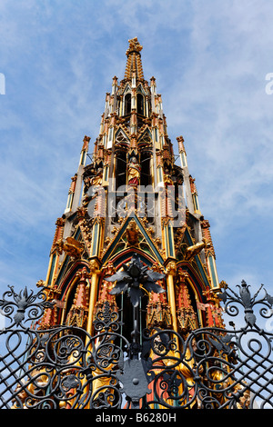 Schoener Brunnen Fountain, shaped like a gothic church spire, cast iron railings, main market, historic city centre, Nuremberg, Stock Photo