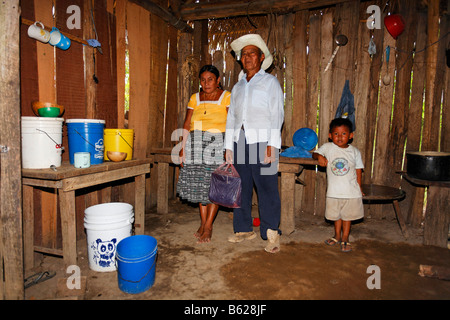 One-room flat, Mayan woman, small boy, fireplace, kitchen utensils