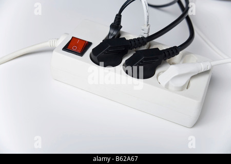 Multiple power socket with switch and plugs Stock Photo