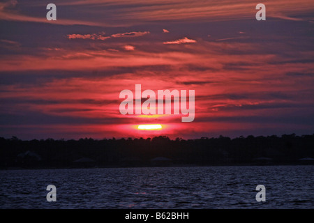 sunset over perdido bay with clouds Stock Photo