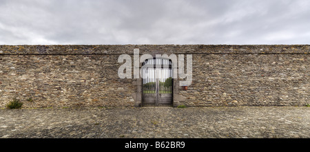 Stonewall, entrance gate to the garden beside the Phare de Saint Mathieu Lighthouse, tone mapped, Brittany, France, Europe Stock Photo