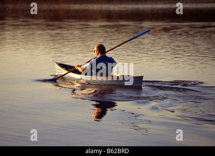 Man kayaking at sunset on Lake Galena, Peace Valley Park, Bucks County, Pennsylvania, USA Stock Photo