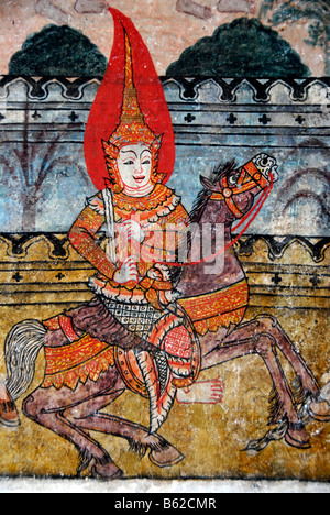 Old Buddhist wall painting, illuminated rider in the Wat Pa Huak temple, Phu Si Berg, Luang Prabang, Laos, South East Asia Stock Photo