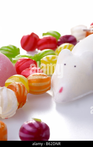 Candy sugar mice and colorful hard sweets on white background Stock Photo