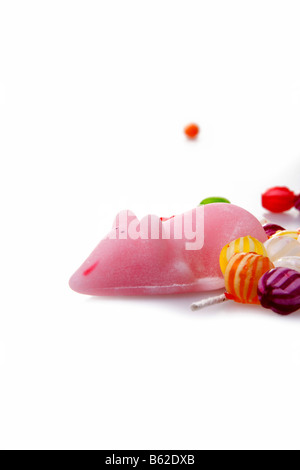 Candy sugar mice and colorful hard sweets on white background Stock Photo