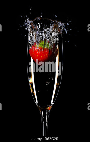 strawberry splash in a champagne flute Stock Photo