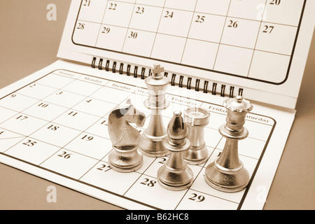 Chess Pieces on Calendar Stock Photo