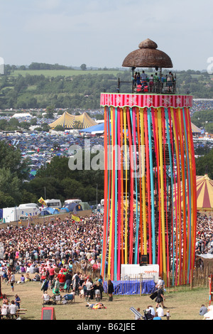Glastonbury pop Festival June 2008 music fans gather in the Park area with viewing tower platform showing whole site Stock Photo