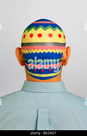 Rear view of a man with his painted head Stock Photo