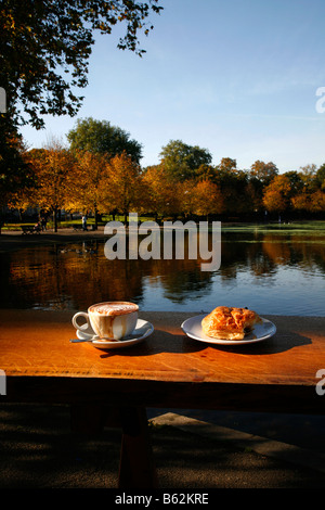 View out from the Pavilion Cafe to the lake in Victoria Park, Hackney, London Stock Photo