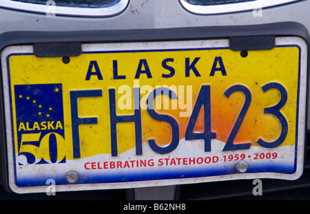 New plate to celebrate Alaska 50th year of state joining USA license plate on car 1959 to 2009 Stock Photo