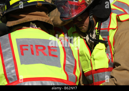 Firefighters working at car accident Stock Photo - Alamy